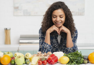 portrait-smiling-woman-looking-vegetables